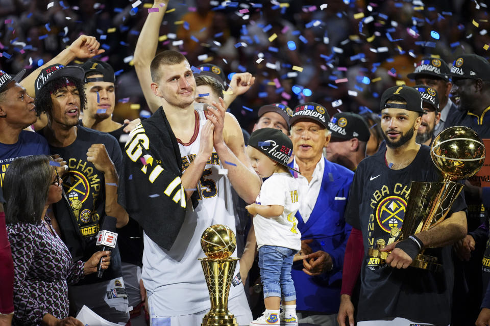 Denver Nuggets center Nikola Jokić celebrates with teammates after winning the 2023 NBA Finals on Monday at Ball Arena in Denver. (AP Photo/Jack Dempsey)