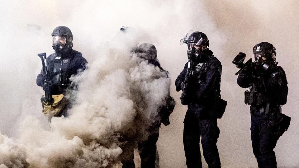 Federal officers use chemical irritants and projectiles to disperse Black Lives Matter protesters near the Mark O. Hatfield United States Courthouse on Friday, July 24, 2020, in Portland, Ore. (Noah Berger/AP)