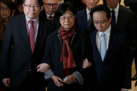 Selina Tsang, wife of former Hong Kong Chief Executive Doanld Tsang, accompanied by sons Simon (L) and Thomas, meets journalists at the High Court in Hong Kong, China February 22, 2017. REUTERS/Bobby Yip