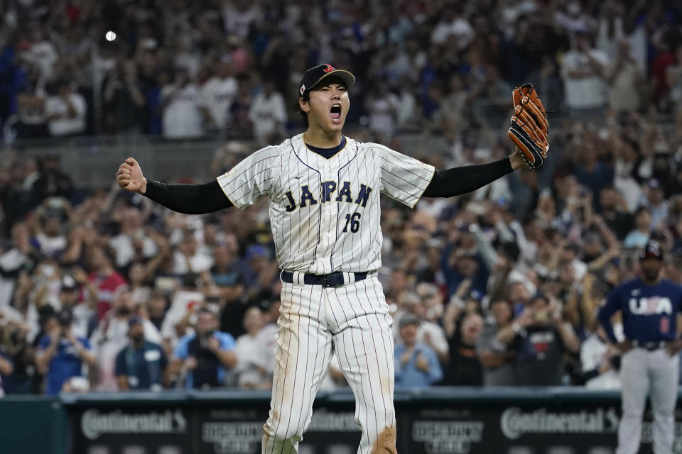 Japan pitcher Shohei Ohtani (16) celebrates after defeating the U.S at the World Baseball Classic final game, Tuesday, March 21, 2023, in Miami. (AP Photo/Marta Lavandier)