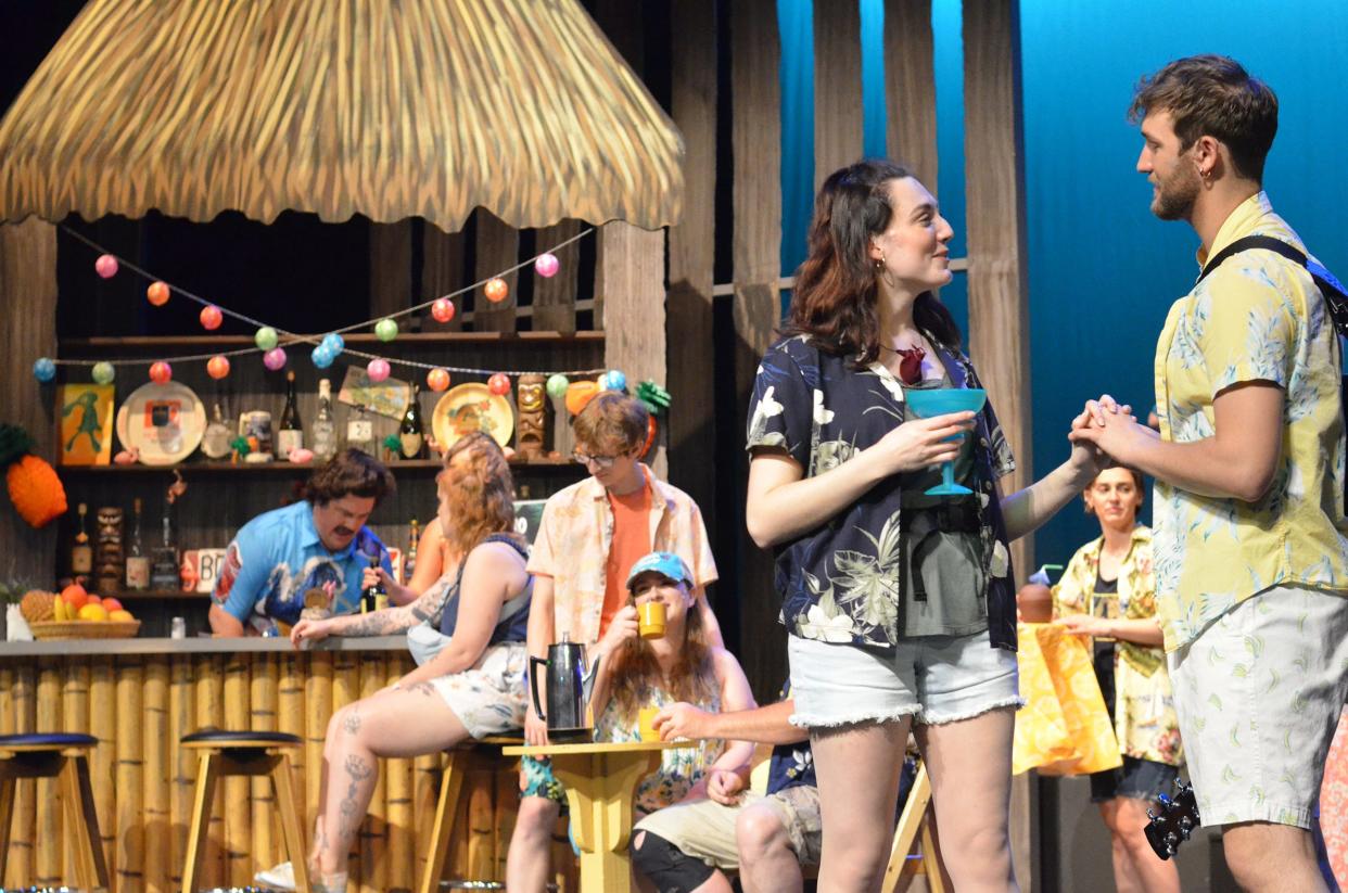 Ally Szymanski as Rachel and Maxwell Lam as Tully flirt at the bar in a scene from “Escape to Margaritaville” at the Croswell Opera House.