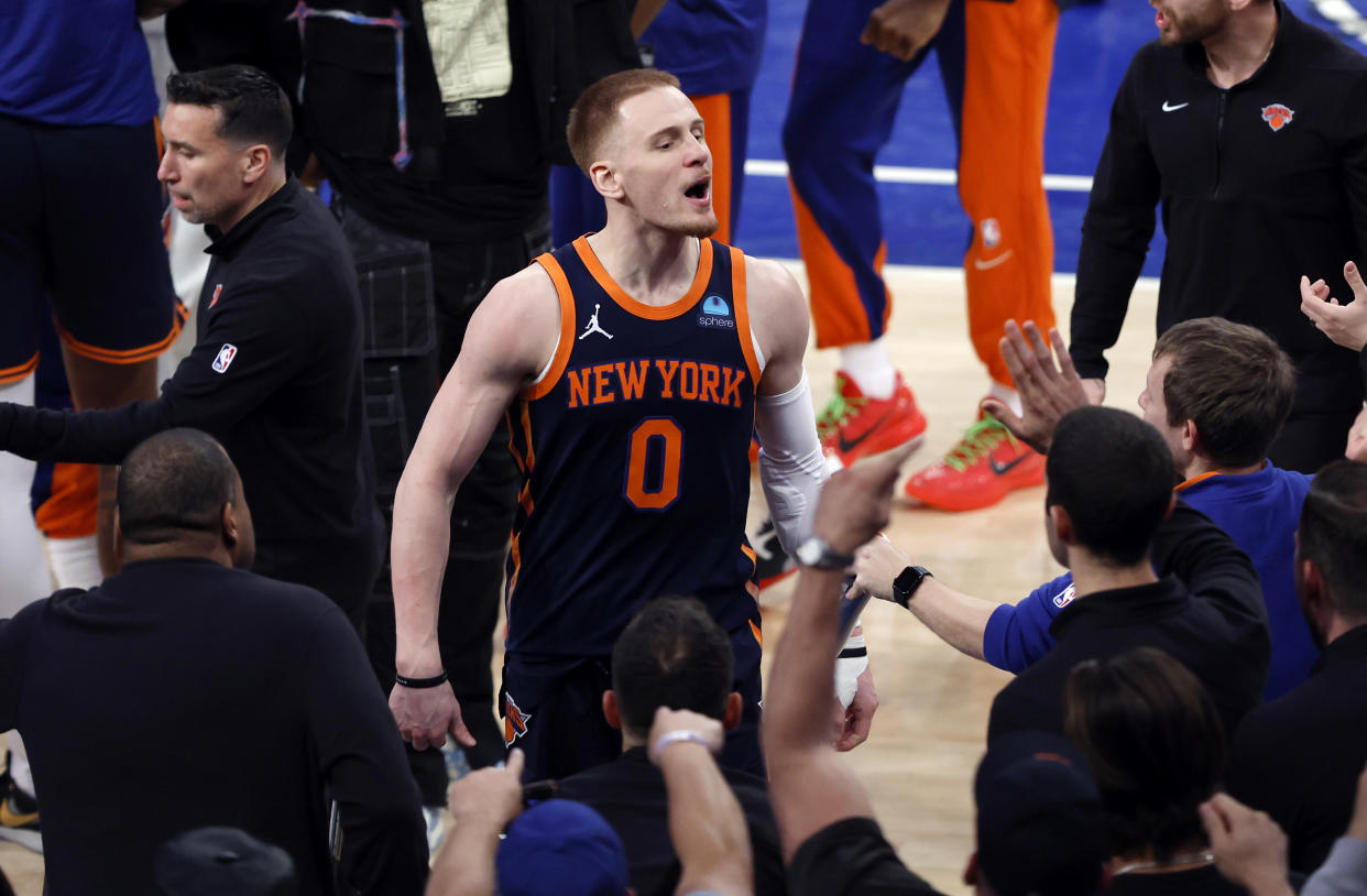 NEW YORK, NEW YORK - APRIL 22: Donte DiVincenzo #0 of the New York Knicks reacts after a three-point shot during the second half against the Philadelphia 76ers in Game Two of the Eastern Conference First Round Playoffs at Madison Square Garden on April 22, 2024 in New York City. The Knicks won 104-101. NOTE TO USER: User expressly acknowledges and agrees that, by downloading and or using this photograph, User is consenting to the terms and conditions of the Getty Images License Agreement. (Photo by Sarah Stier/Getty Images)