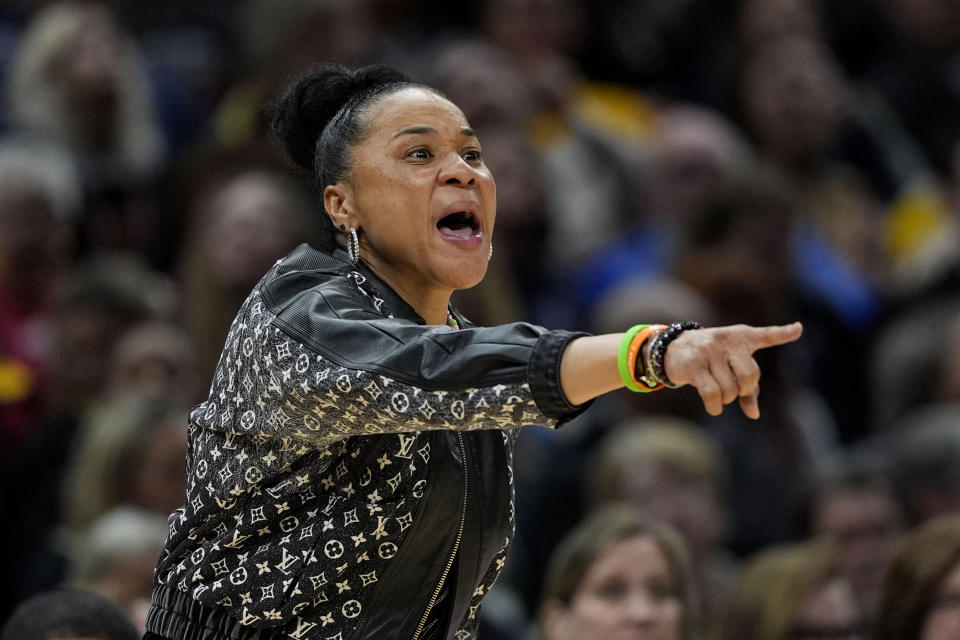 South Carolina head coach Dawn Staley directs her team during the second half of a Final Four college basketball game against North Carolina State in the women's NCAA Tournament, Friday, April 5, 2024, in Cleveland. (AP Photo/Carolyn Kaster)
