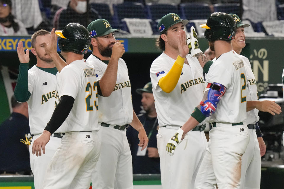 Australian players celebrate after defeating China in their Pool B game at the World Baseball Classic at the Tokyo Dome, Japan, Saturday, March 11, 2023. (AP Photo/Eugene Hoshiko)