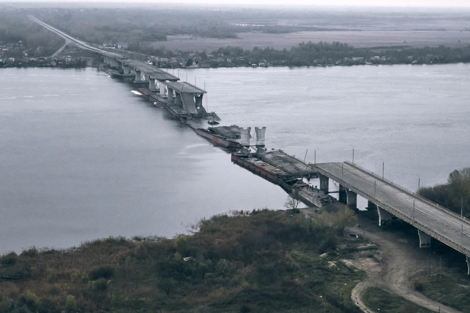 A view of the damaged Antonovsky bridge over the Dnipro river in Kherson.