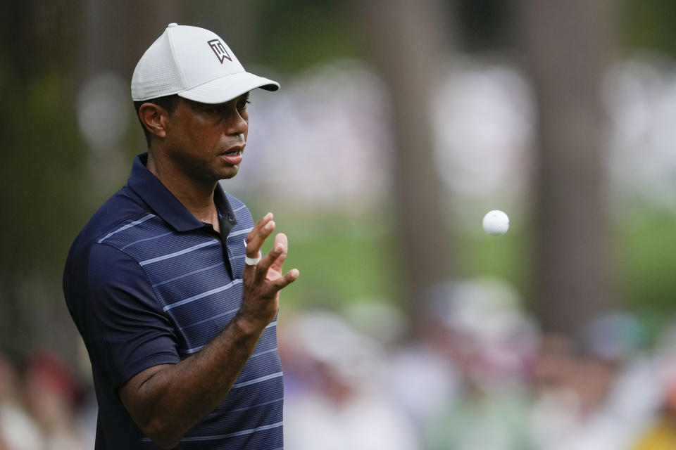 Tiger Woods catches his ball on the sixth hole during the second round of the Masters golf tournament at Augusta National Golf Club on Friday, April 7, 2023, in Augusta, Ga. (AP Photo/Matt Slocum)