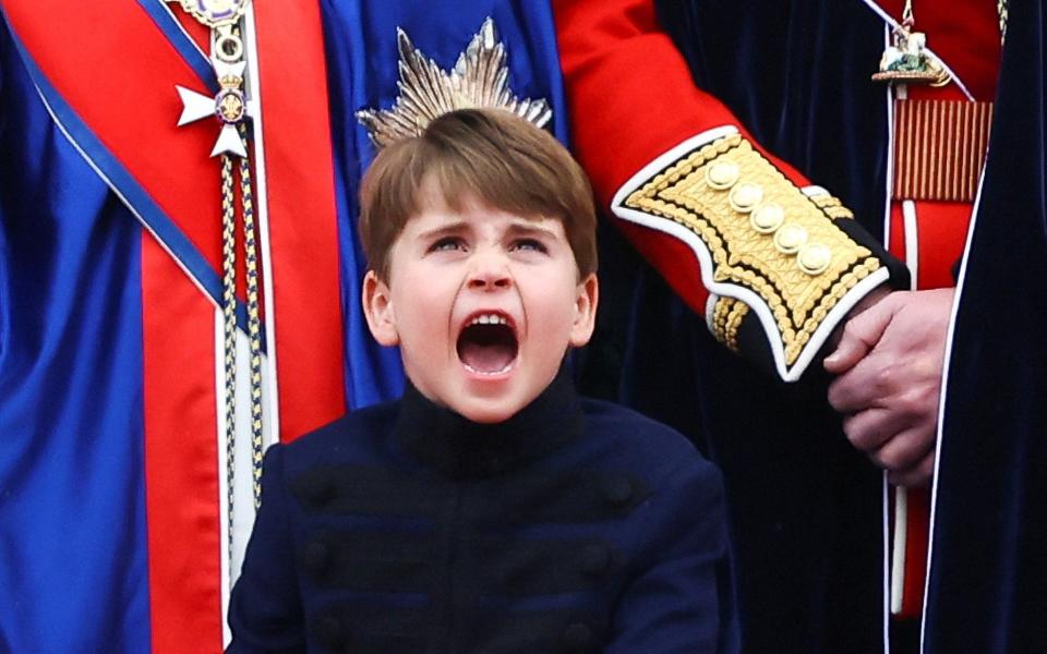 Prince Louis stands on the Buckingham Palace balcony - HANNAH MCKAY