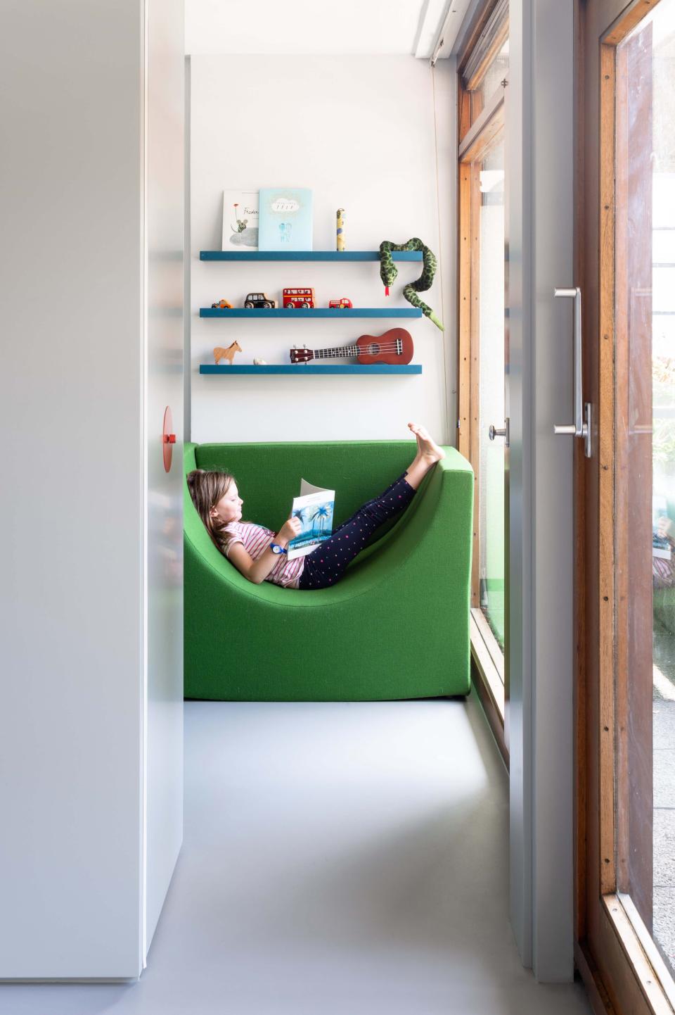 The movable furniture can be pulled out into the bedroom, which is partitioned off from the living area by a sliding door. Talk about ingenious.