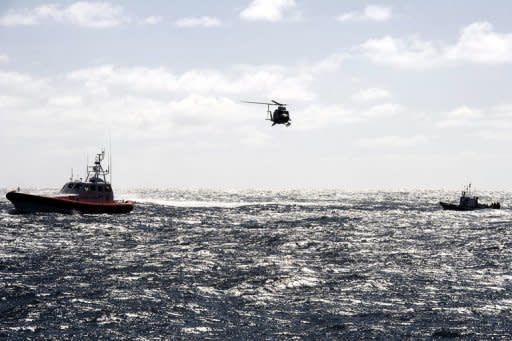 File photo of a boat full of would be immigrants being escorted by an Italian Guardia di Fininanza helicopter and an Italian Coast Guard patrol vessel before reaching the port of Lampedusa in March 2011. Lampedusa, which has a surface area of just 20 square kilometres, is Italy's southernmost point and is closer to North Africa than to the Italian mainland