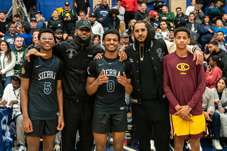 Bryce James, LeBron James, Bronny James, Carmelo Anthony and Kiyan Anthony pose at the Sierra Canyon vs. Christ The King boys high school basketball game on Dec. 12, 2022. (Cassy Athena/Getty Images)