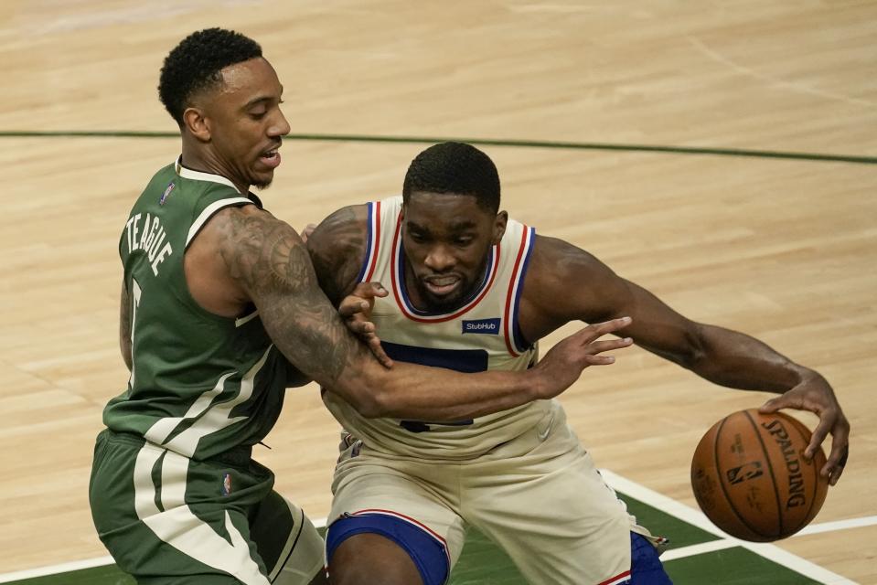 Philadelphia 76ers' Shake Milton tries to get past Milwaukee Bucks' Jeff Teague during the first half of an NBA basketball game Saturday, April 24, 2021, in Milwaukee. (AP Photo/Morry Gash)