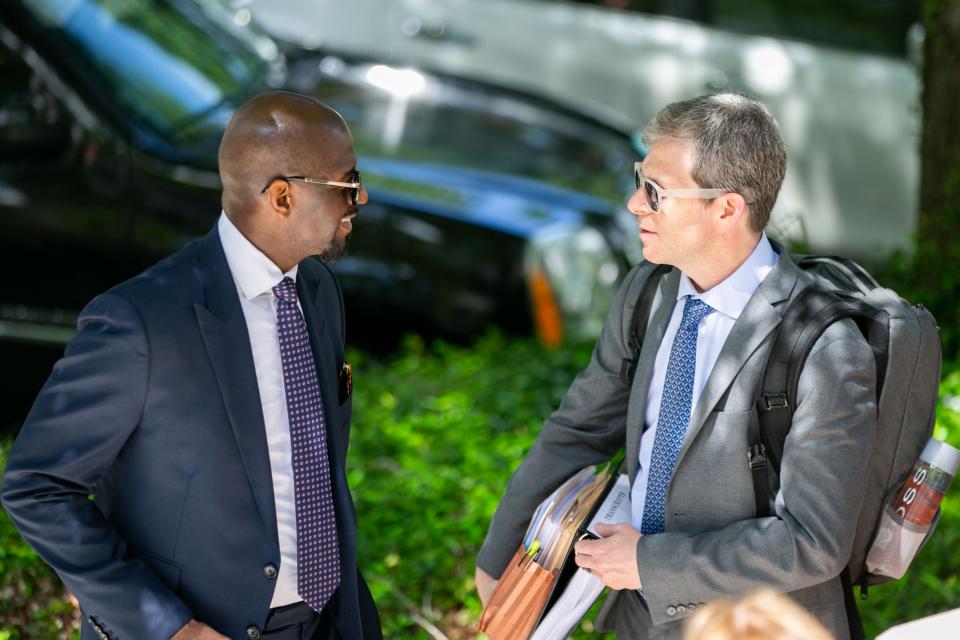 Former Tallahassee Mayor and 2018 Democratic nominee for Florida Governor, Andrew Gillum, left, speaks with his defense attorney David Markus outside the Federal Courthouse before a pretrial hearing on Monday, April 10, 2023.
