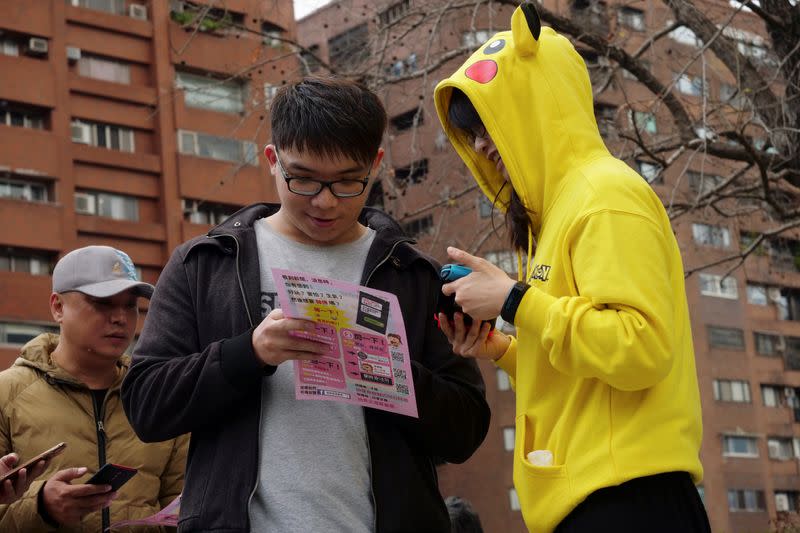 People attend an event organised by Taiwanese NGO Fake News Cleaner on how to spot and report suspected fake news, in New Taipei City