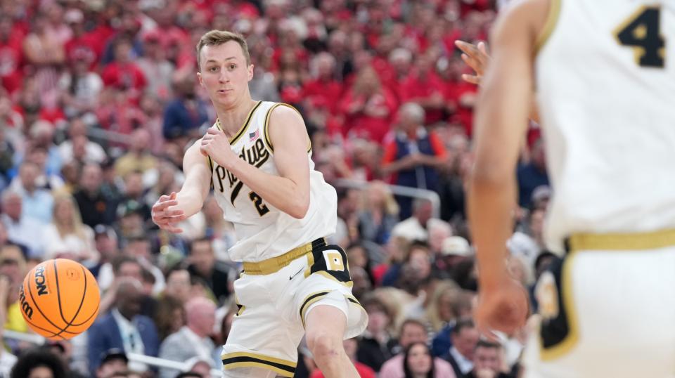 Purdue Boilermakers guard Fletcher Loyer (2) passes the ball to Purdue Boilermakers forward Trey Kaufman-Renn (4) during the NCAA Men’s Basketball Tournament Final Four game against the North Carolina State Wolfpack, Saturday, April 6, 2024, at State Farm Stadium in Glendale, Ariz.