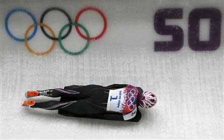 Noelle Pikus-Pace of the U.S. competes in the women's skeleton event at the 2014 Sochi Winter Olympics, at the Sanki Sliding Center in Rosa Khutor February 14, 2014. REUTERS/Fabrizio Bensch