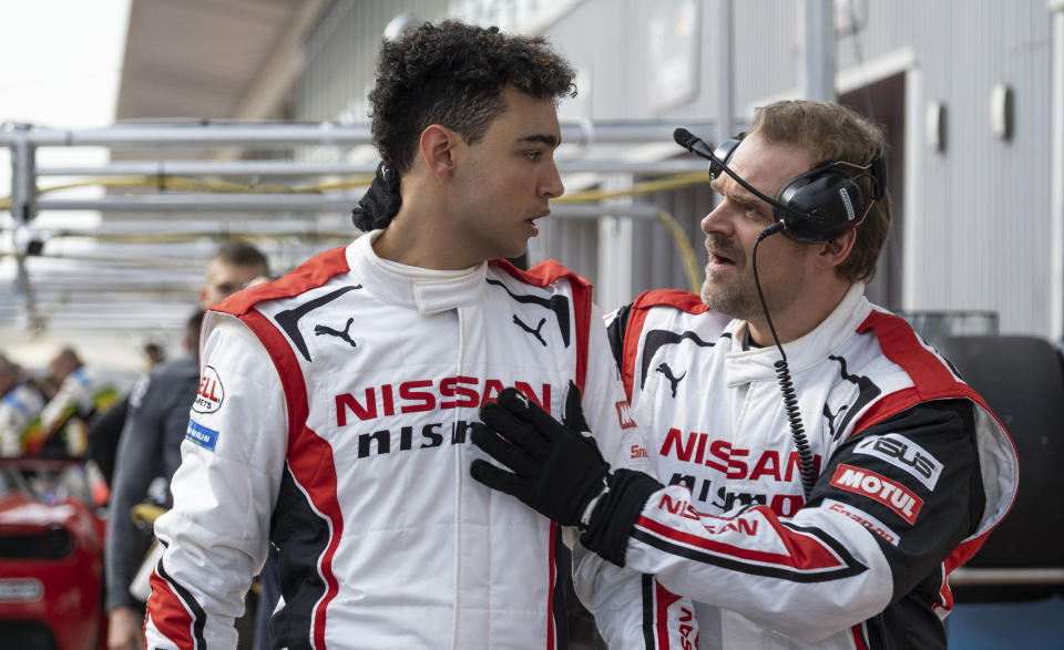 This image released by Columbia Pictures shows Archie Madekwe, left, and David Harbour in a scene from "Gran Turismo." (Gordon Timpen/Columbia Pictures/Sony Entertainment via AP)