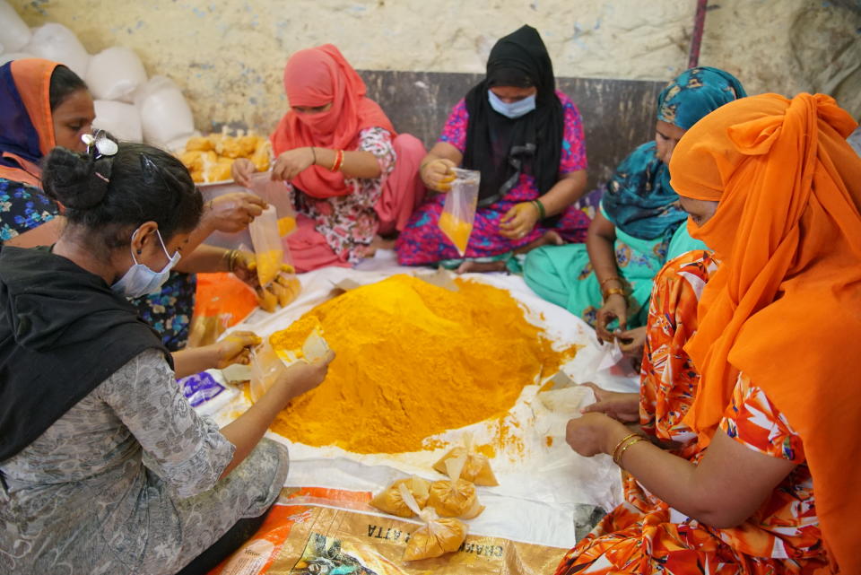 Feeding From Far volunteers packing haldi