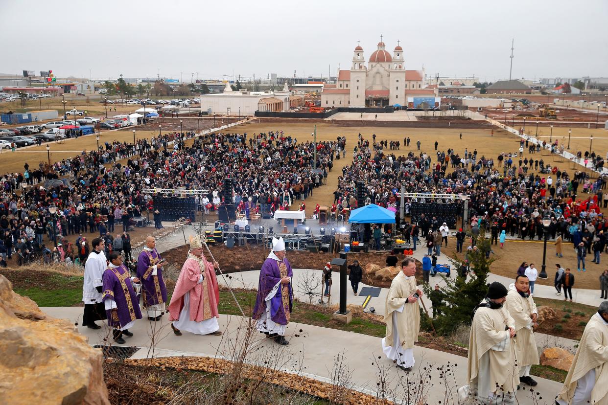 The Most Rev. Paul S. Coakley, archbishop of the Roman Catholic Archdiocese of Oklahoma City, fourth from left, along with other clergy members make their way up Tepeyac Hill during an outdoor Mass and dedication of the hill on Dec. 11 at the Blessed Stanley Rother Shrine in Oklahoma City.