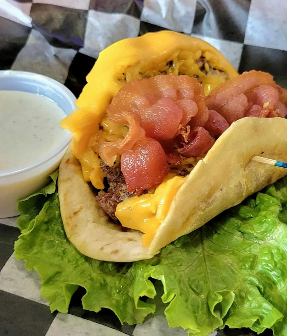 The Pickled Okra in Forsyth, Georgia is offering a cheeseburger taco during Taco Week 2024.