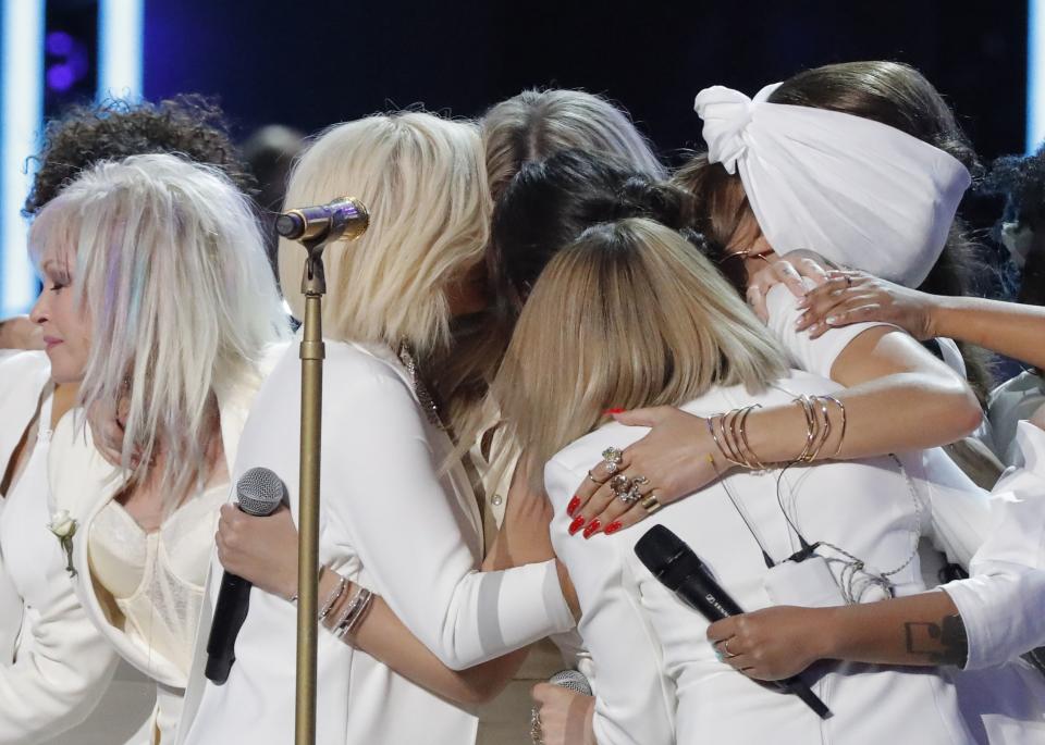 Kesha (rear, center) is embraced by her fellow singers after performing “Praying.” (Photo: REUTERS/Lucas Jackson)