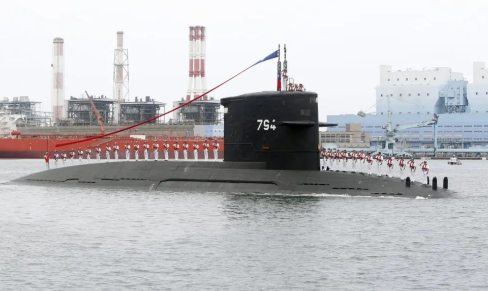 Taiwanese sailors salute aboard the <em>Hai Lung</em> class submarine <em>Hai Hu</em>, which was commissioned into ROCN service in 1988. <em>AP/Chiang Ying-ying</em>