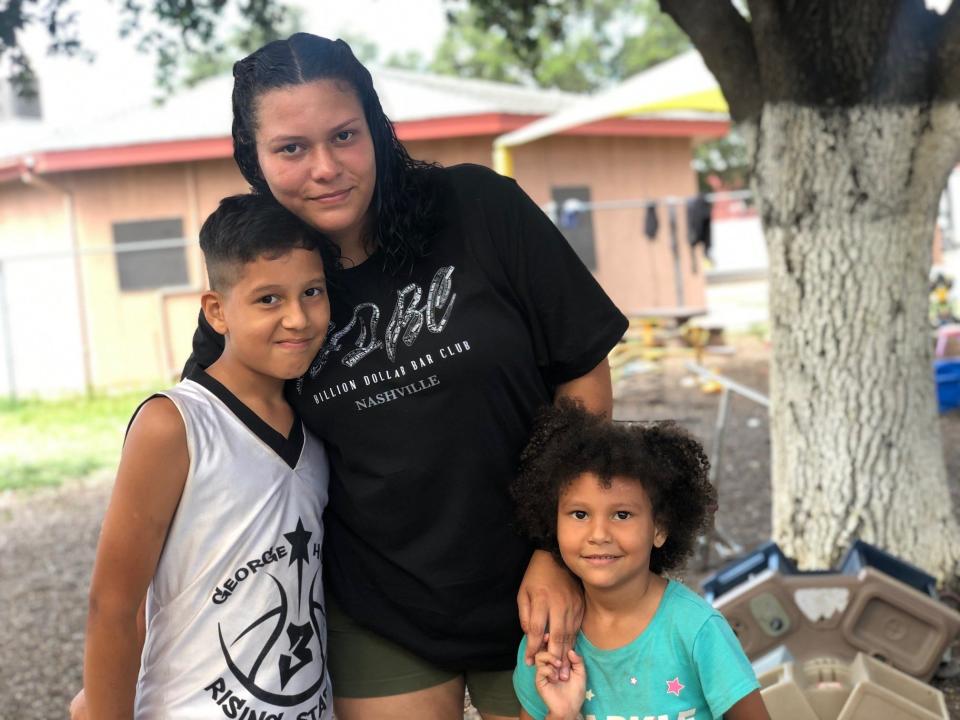 Yetsimar Landeata, 29, of Caracas, Venezuela, with her son, Walyer, 11, and Waleska, 6, at a migrant shelter in Laredo. It took her 30 days to travel from Caracas to the Texas-Mexico border.