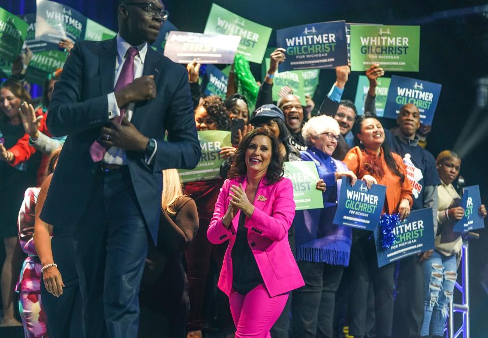 Gov. Gretchen Whitmer and Lt. Gov. Garlin Gilchrist II take the stage to speak to a crowd while celebrating her reelection during the Michigan Democratic watch party for the midterm elections at the Motor City Casino Sound Board in Detroit in the early morning on Wednesday., Nov. 9, 2022.