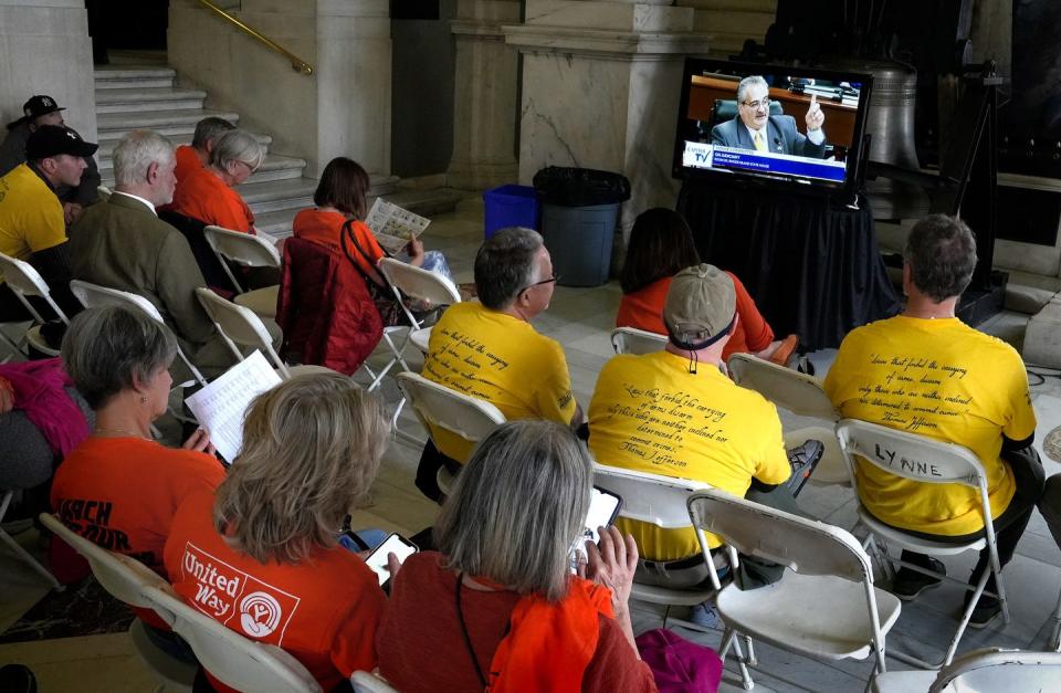 Gun control advocates and gun rights supporters sit in the overflow Bell Room at the State House to listen to testimony by gun rights lawyer Frank Saccocco.