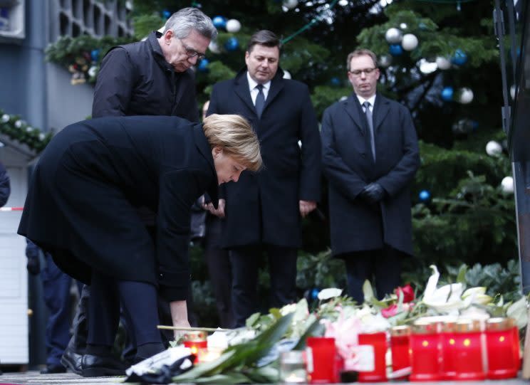 German Chancellor Angela Merkel lays flowers at the Christmas market in Berlin, Germany, December 20, 2016, one day after a truck ploughed into a crowded Christmas market in the German capital. (Photo: Hannibal Hanschke/Reuters)