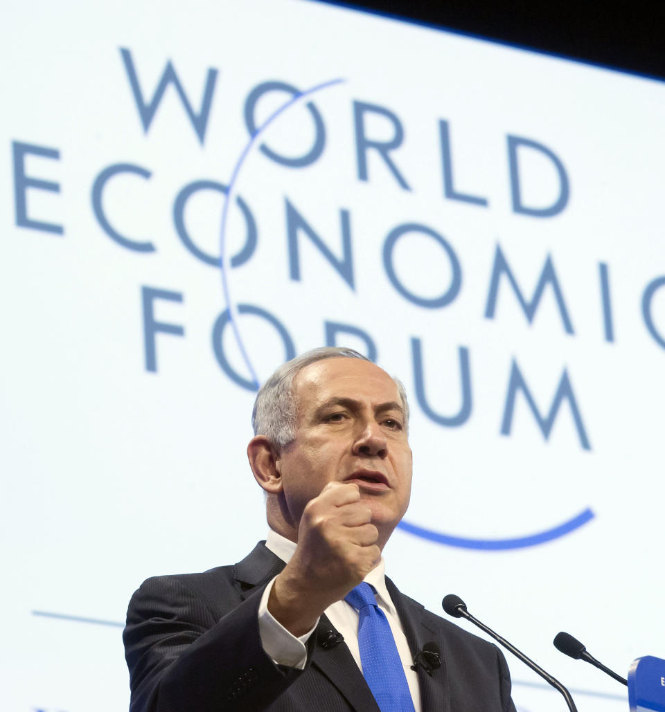 Israeli Prime Minister Benjamin Netanyahu gestures as he speaks during a session at the World Economic Forum in Davos, Switzerland, Thursday, Jan. 23, 2014. Leaders gathered in the Swiss ski resort of Davos have made it a top priority to push to reshape the global economy and cut global warming by shifting to cleaner energy sources. (AP Photo/Michel Euler)