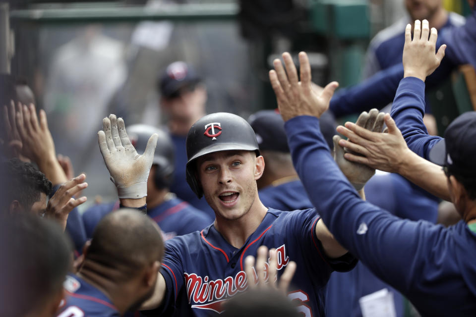 Minnesota Twins' Max Kepler, center, celebrates his two-run home run with teammates in the dugout during the seventh inning of the team's baseball game against the Los Angeles Angels on Thursday, May 23, 2019, in Anaheim, Calif. (AP Photo/Marcio Jose Sanchez)