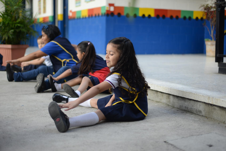 Valentina Rodas stretches at school in Guatemala City on July 8, 2013. 