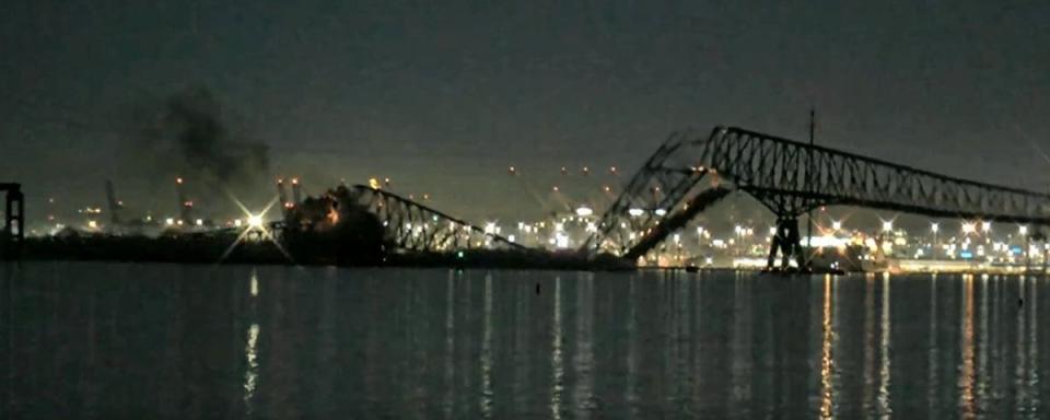 The Francis Scott Key Bridge collapses in the middle after it is hit by a container ship (Sky News)