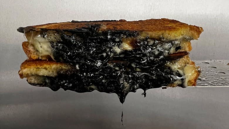 melted charcoal cheddar on sandwich