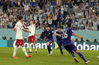 Argentina's Julian Alvarez (9) celebrates after scoring a goal during the World Cup group C soccer match between Poland and Argentina at the Stadium 974 in Doha, Qatar, Wednesday, Nov. 30, 2022. (AP Photo/Natacha Pisarenko)