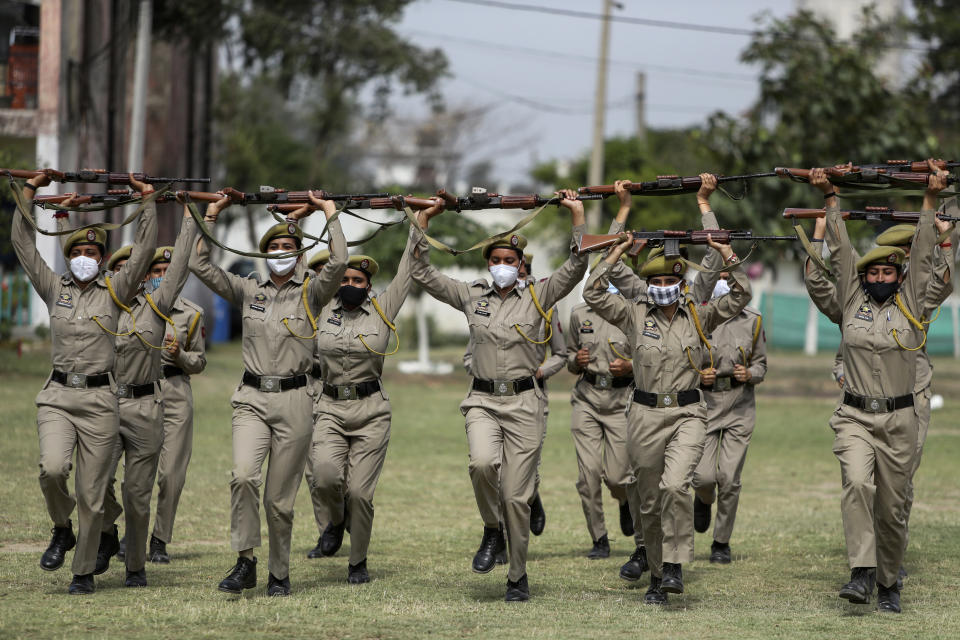 Special police officer recruits who completed nearly three months physical training demonstrate their skills at Kathua in Indian-controlled Kashmir, Saturday, June 5, 2021. Special police officers are lower-ranked police officials who are mainly recruited for intelligence gathering and counterinsurgency operations. In recent years, the force has assisted in border areas as well because of local recruits' familiarity with the topography and ability to assist police and border guards during emergencies. (AP Photo/Channi Anand)