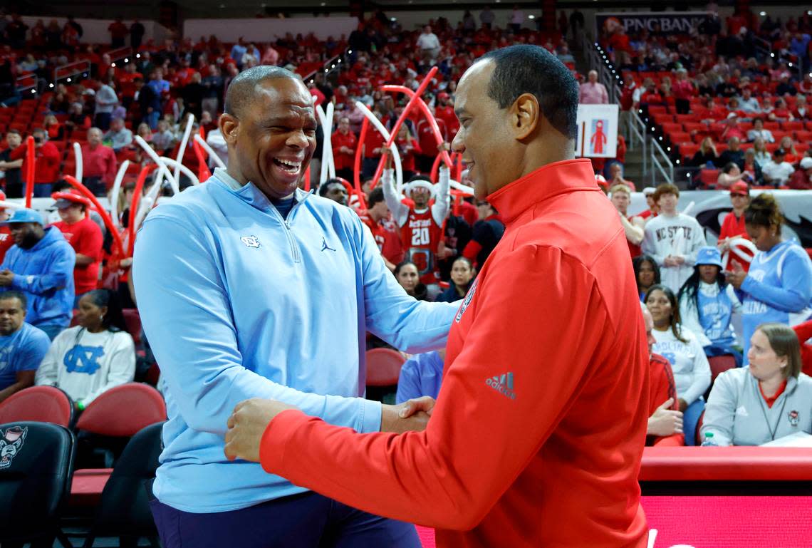 North Carolina head coach Hubert Davis greets N.C. State head coach Kevin Keatts before N.C. State’s game against UNC at PNC Arena in Raleigh, N.C., Sunday, Feb. 19, 2023.