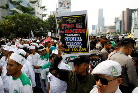 Islamists hold a protest rally outside Facebook's local headquarters accusing the social media giant of discrimination for blocking some pages operated by hardline groups in Jakarta, Indonesia January 12, 2018. REUTERS/Darren Whiteside