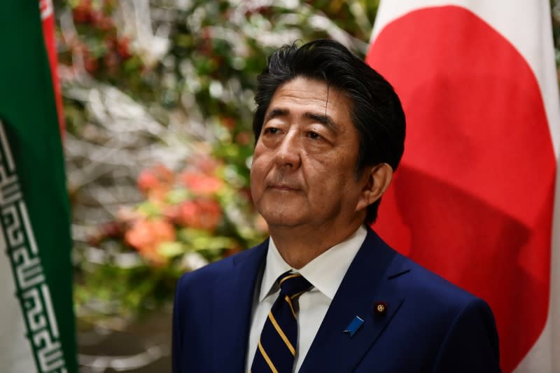 FILE PHOTO: Japanese PM Abe and Iranian President Rouhani meet in Tokyo