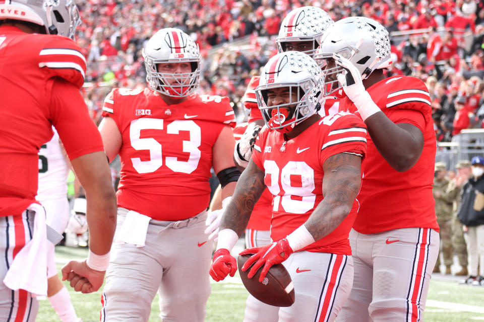 Miyan Williams (right) of the Ohio State Buckeyes celebrates his first-half touchdown run with teammates while playing Michigan State on Saturday. (Gregory Shamus/Getty Images)