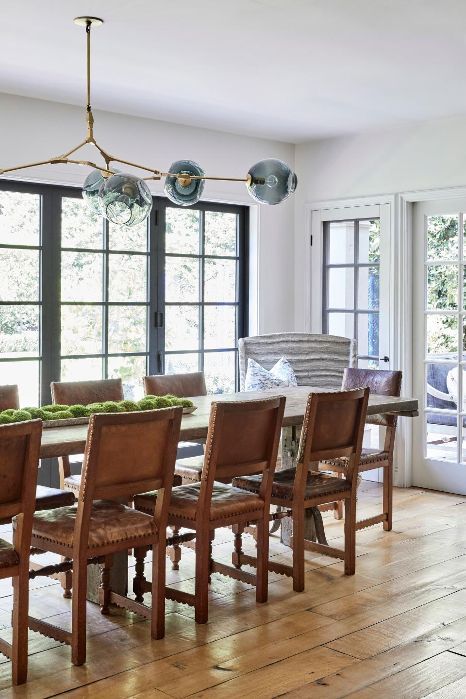 “We don’t eat dinner there as often as we should,” says Duff of her kitchen’s dining area, “but with the age difference going on here, I feel like we’re not going to sit down and eat at the same time for a couple of more years.” Still, the family makes plenty of use of its table from Galerie Half on Melrose. Explains Duff, “There’s coloring, and doing homework, and even meetings. And it’s definitely our holiday table.” The chairs are vintage, from Belgium. The chandler is by Lindsey Adelman Studio. Accordion doors open completely to the outside.