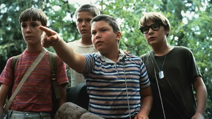 The kids in Stand By Me, one pointing and them all looking.