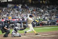 Milwaukee Brewers' Joey Ortiz hits a walk off RBI single during the 11th inning of a baseball game against the New York Yankees Friday, April 26, 2024, in Milwaukee. (AP Photo/Morry Gash)