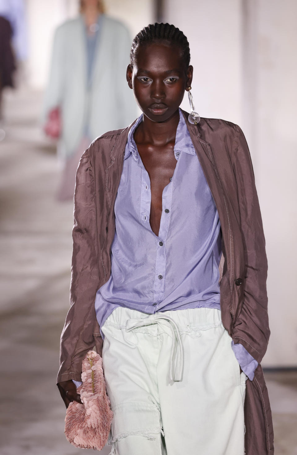 A model wears a creation for the Dries Van Noten ready-to-wear Spring/Summer 2023 fashion collection presented Wednesday, Sept. 28, 2022 in Paris. (Photo by Vianney Le Caer/Invision/AP)