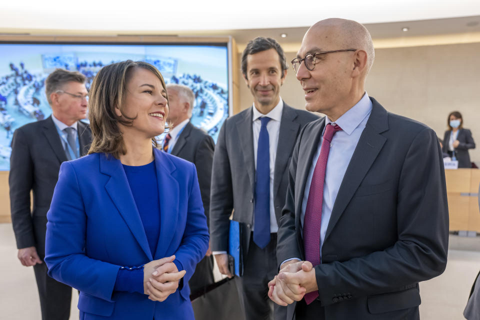 German Foreign Minister Annalena Baerbock, left, speaks with Volker Tuerk, right, UN High Commissioner for Human Rights, during a special Human Rights Council session at the European headquarters of the United Nations in Geneva, Switzerland, Thursday, Nov. 24, 2022. (Martial Trezzini/Keystone via AP)