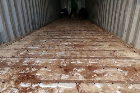 Packages of drugs are seen under the bottom of a container of the cargo ship "Noka" following an operation of the Hellenic Coast Guard, in which cannabis and super-strength amphetamine pills worth more than 100 million euros were confiscated, at the port of Heraklion on the island of Crete, Greece, December 13, 2018. Hellenic Coast Guard /Handout via REUTERS