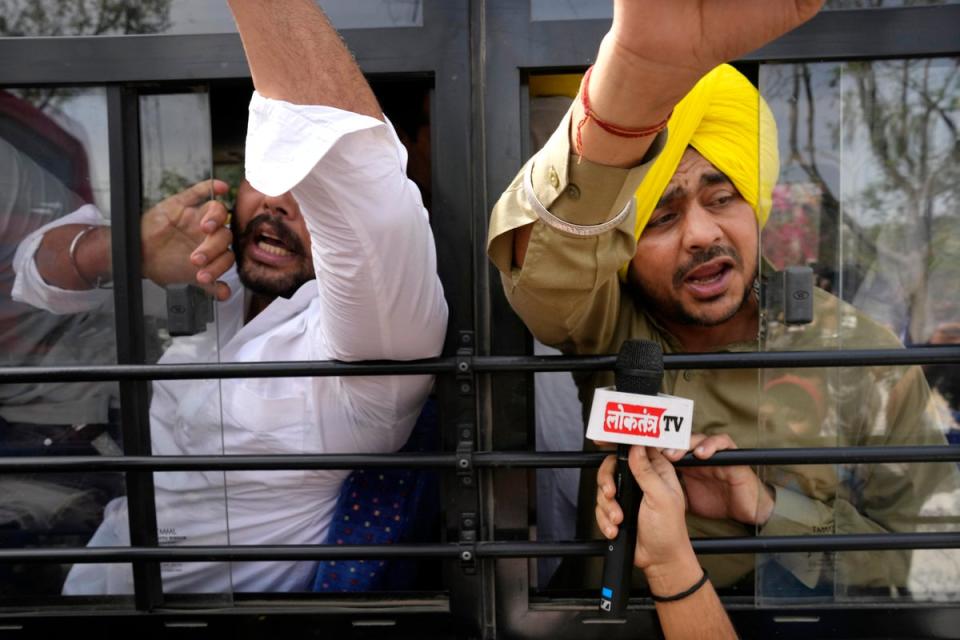 Members of Aam Admi Party, or Common Man’s Party, shout slogans as they are detained by police during a protest against the arrest of their party leader Arvind Kejriwal in New Delhi, India, Tuesday, 26 March 2024. (AP)