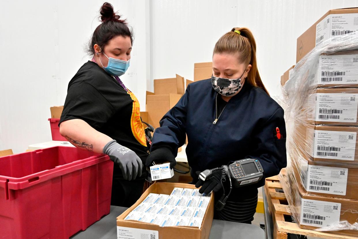 <p>Employees with the McKesson Corporation scan a box of the Johnson & Johnson Covid-19 vaccine as they fill an order at their shipping facility in Shepherdsville, Kentucky</p> (Getty Images)