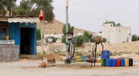 A shop with fuel smuggling stirs is seen along a roadside in Remada town south Tunisia, October 12, 2018. Picture taken October 12, 2018. REUTERS/Zoubeir Souissi