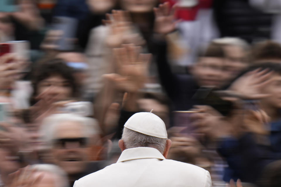 Pope Francis waves faithful as he arrives for his weekly general audience in St. Peter's Square, at the Vatican, Wednesday, April 3, 2024. (AP Photo/Alessandra Tarantino)